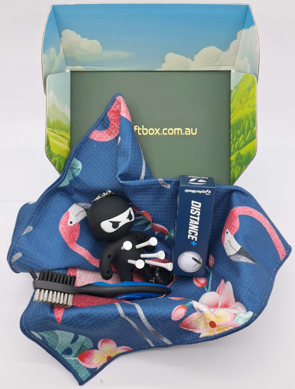 Golf gift box with ninja tee holder and golf towel
