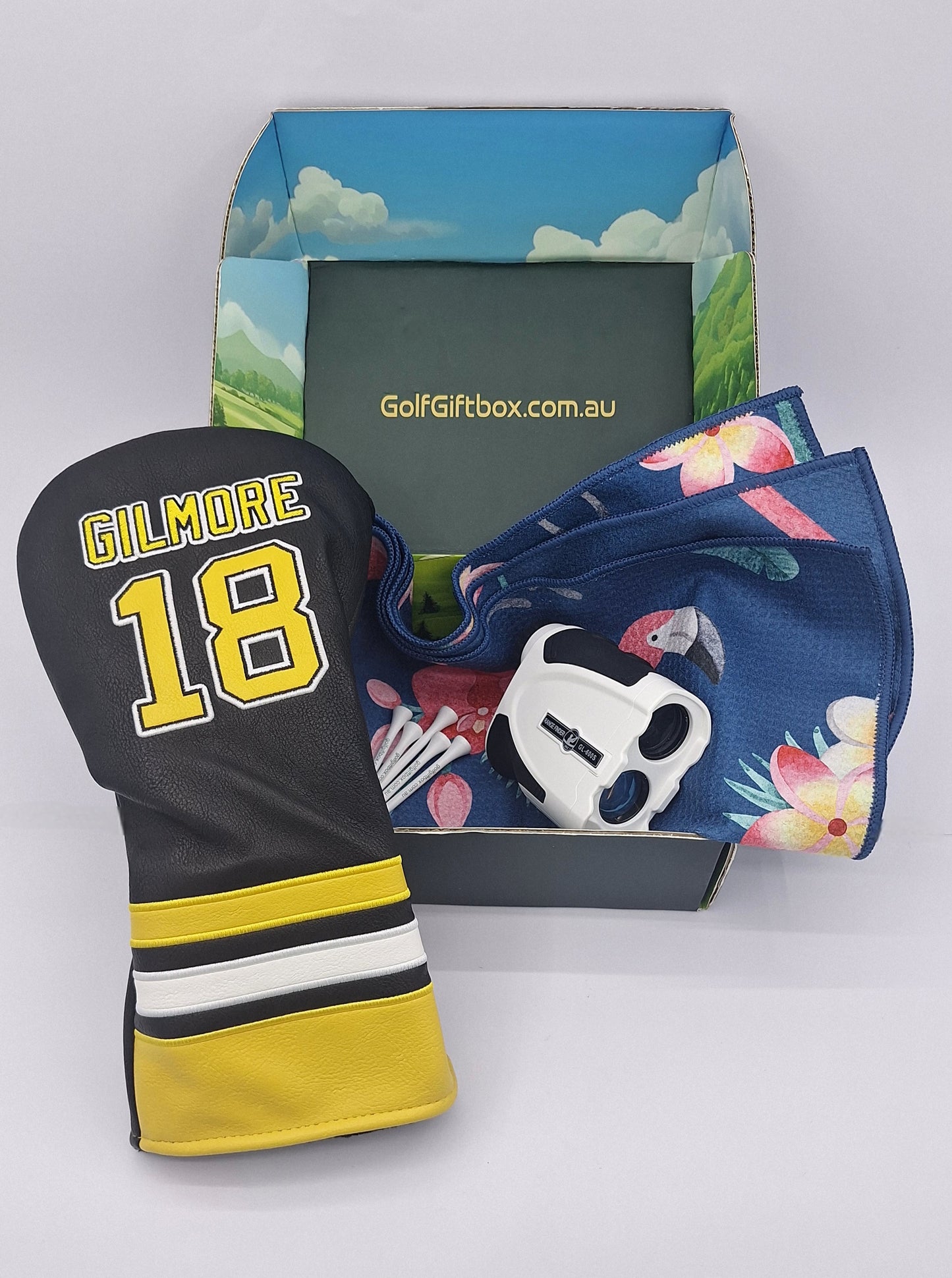 Golf gift Champions Box with rangefinder and happy gilmore club head cover and golf towel